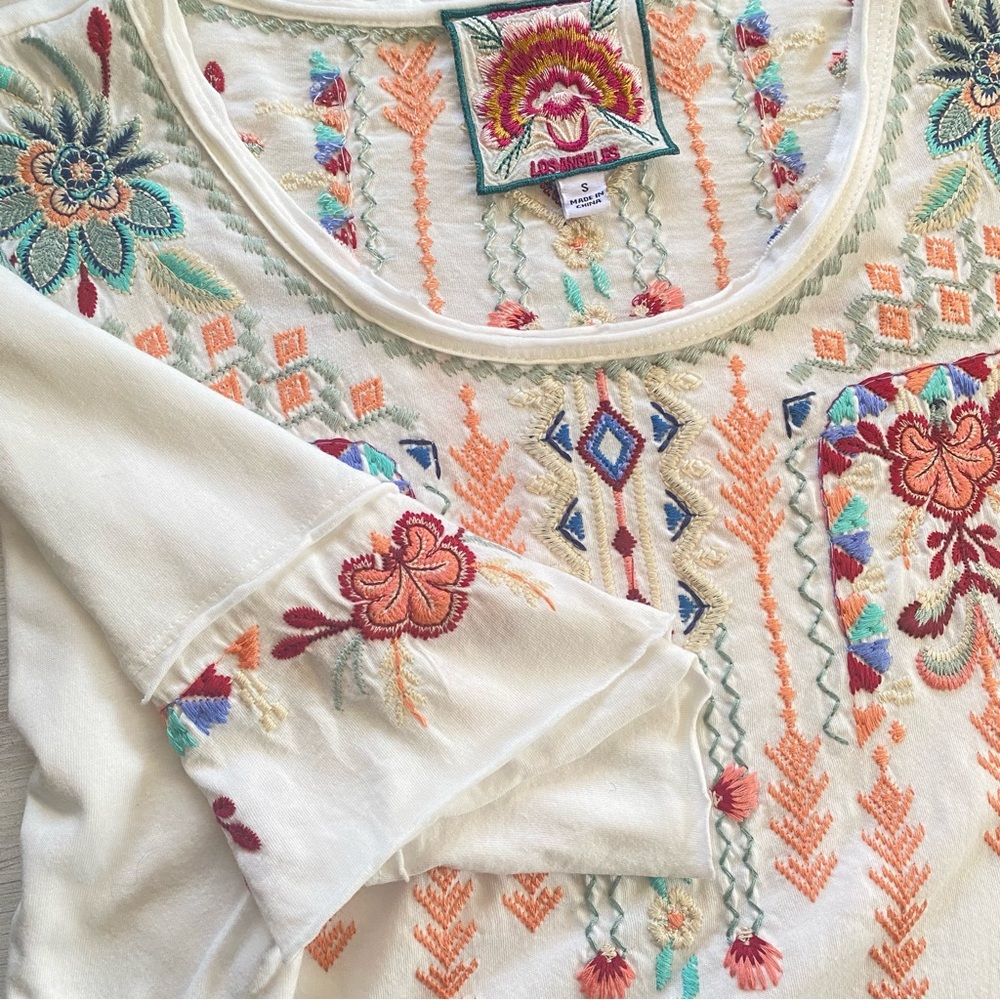 Johnny Was Knit Dress with handkerchief hem with floral embroidery.